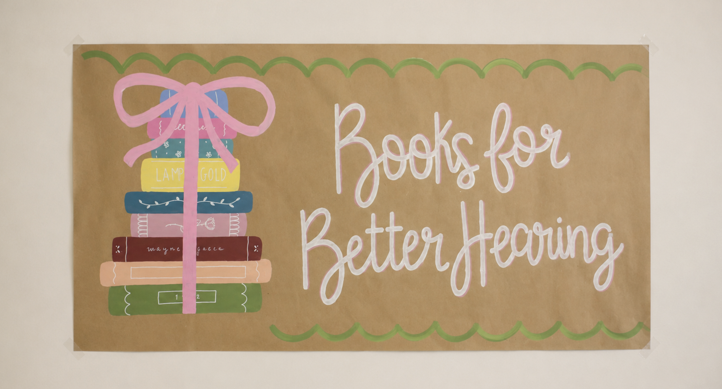 Hand-painted Books for Better Hearing banner with illustrated books and bow, scallop border