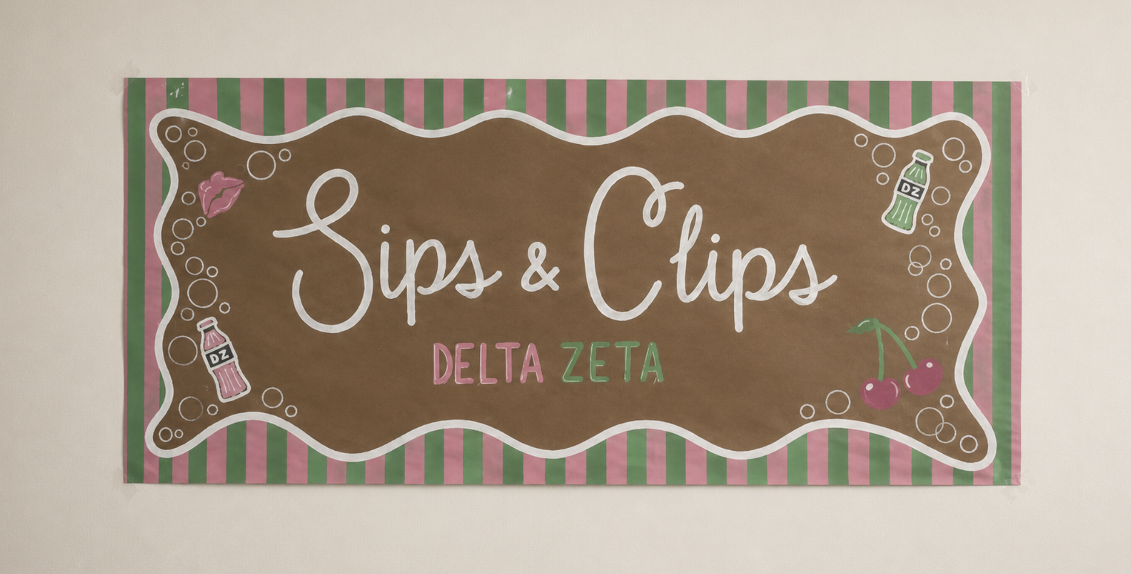 Hand-painted Sips and Clips Delta Zeta banner with pink and green stripes
